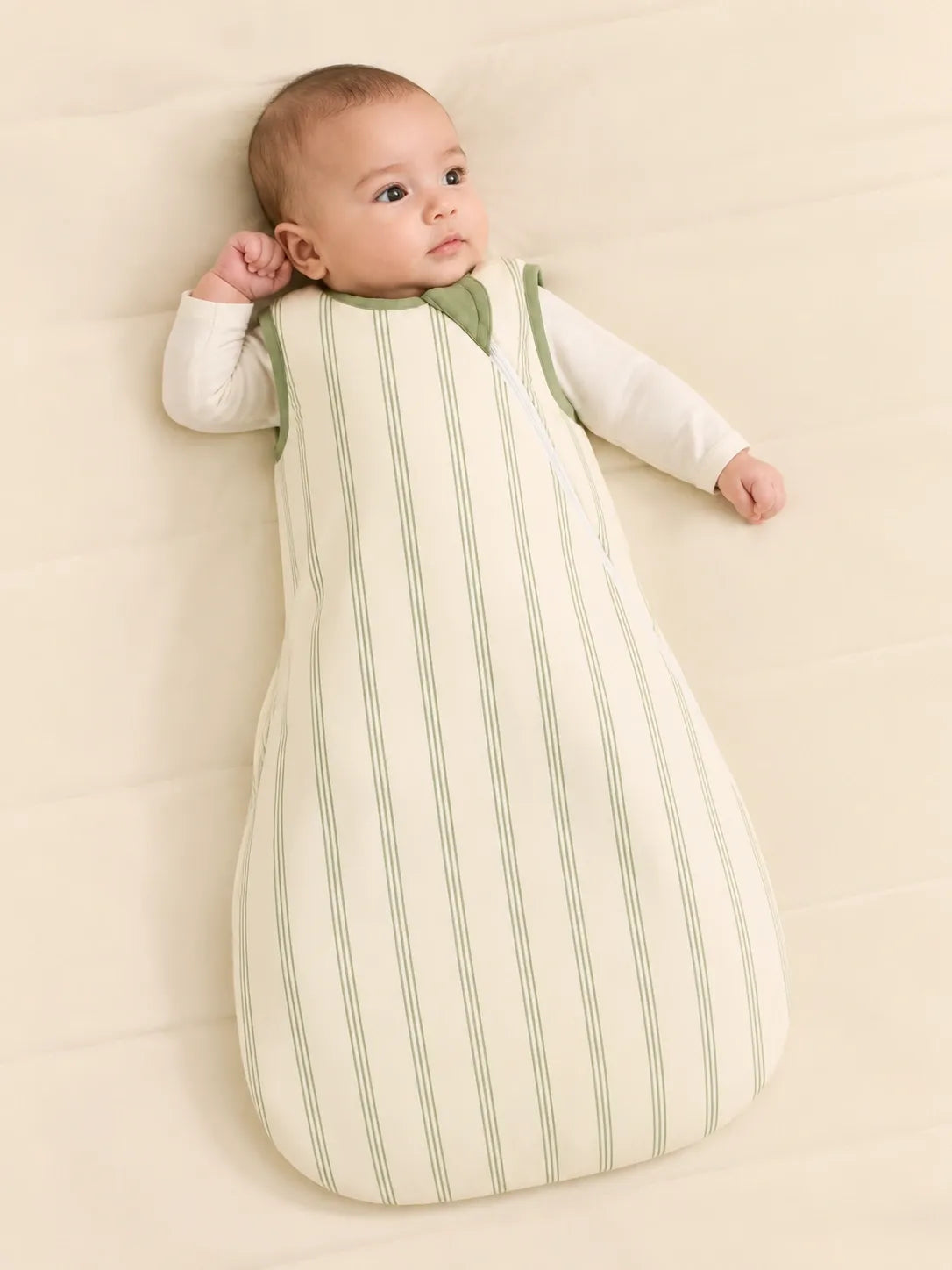 Baby wearing the Sage Stripe bamboo sleep bag