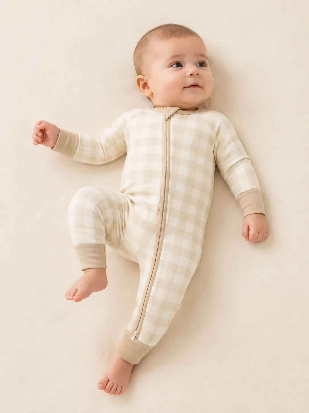 Baby wearing the Oat Gingham bamboo zipper romper