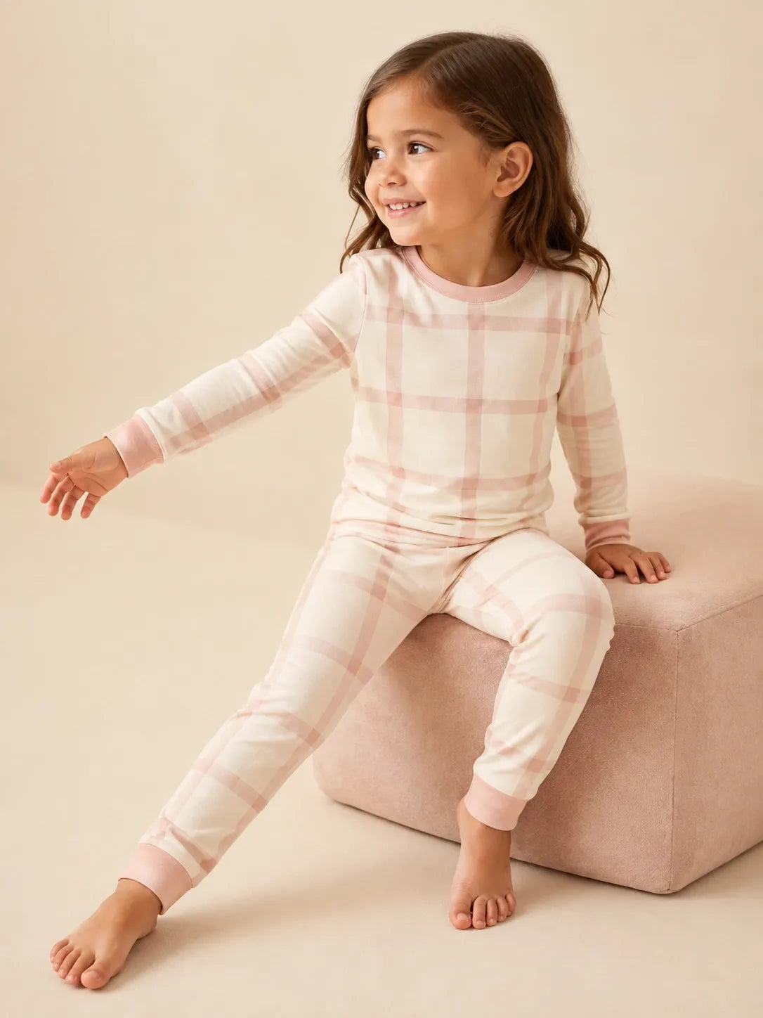 Child wearing the Blush Plaid long sleeve pajama set