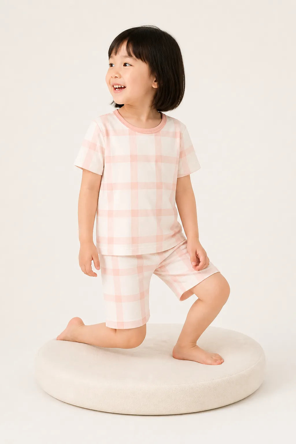 Child wearing the Blush Plaid short sleeve pajama set
