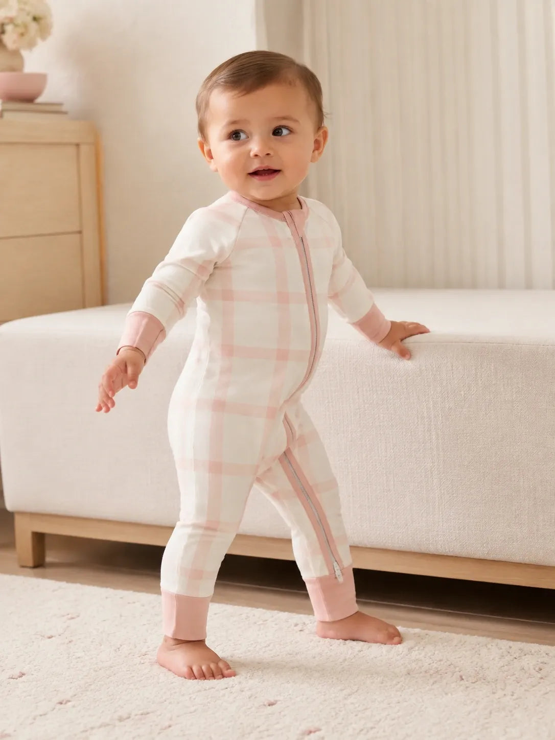 Baby playing at home in the Blush Plaid zipper romper