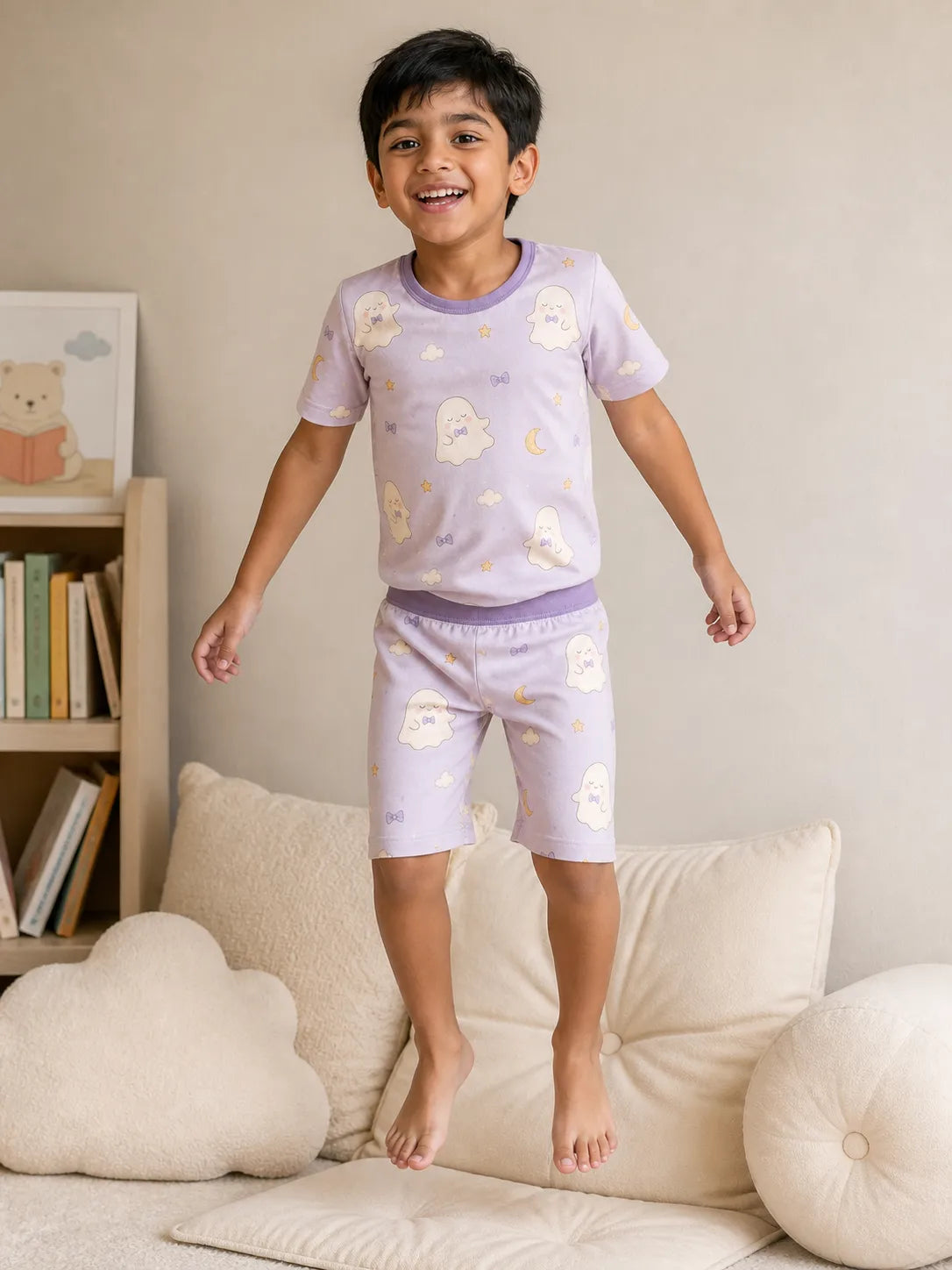 Child playing at home in Boo & Moon bamboo pajamas
