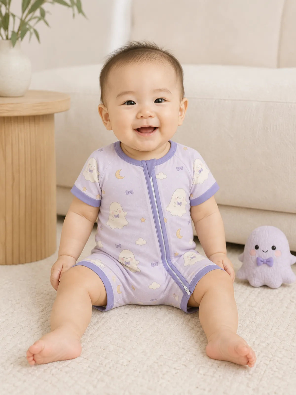 Baby playing at home in the Boo & Moon shorty romper