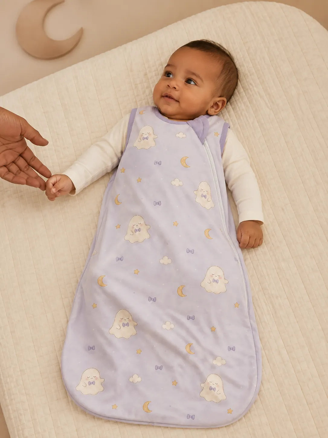 Baby resting comfortably in the Boo & Moon bamboo sleep bag