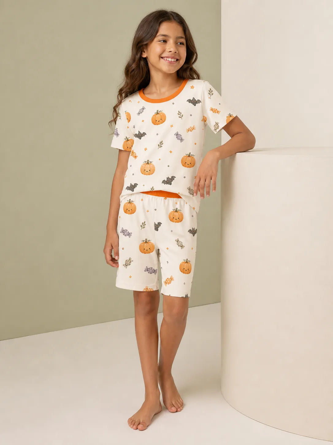 Child playing at home in Pumpkin Treats bamboo pajamas