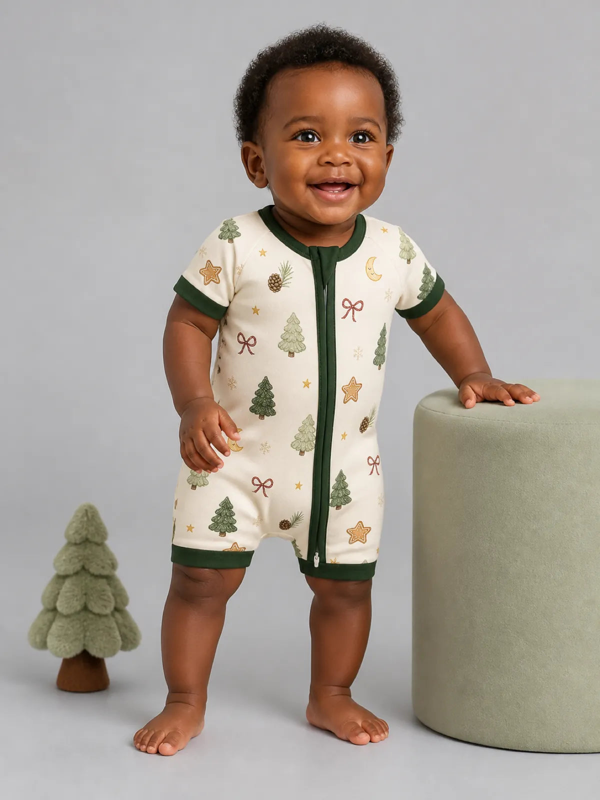 Baby wearing the Christmas Forest bamboo shorty romper