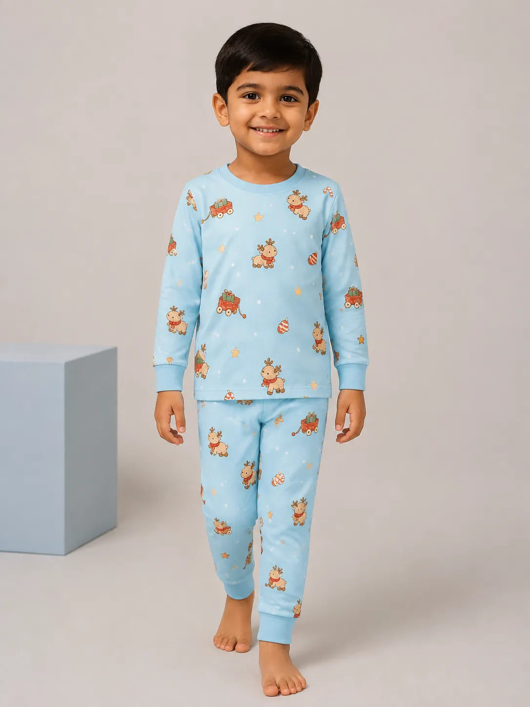 Child wearing the Reindeer Ride long sleeve pajama set