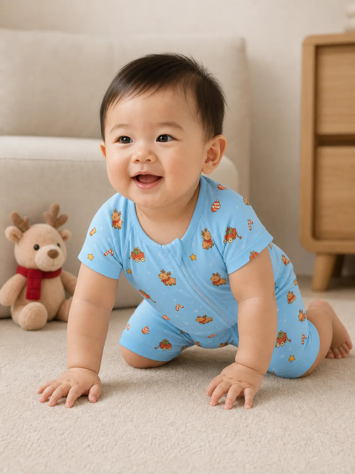 Baby playing at home in the Reindeer Ride shorty romper