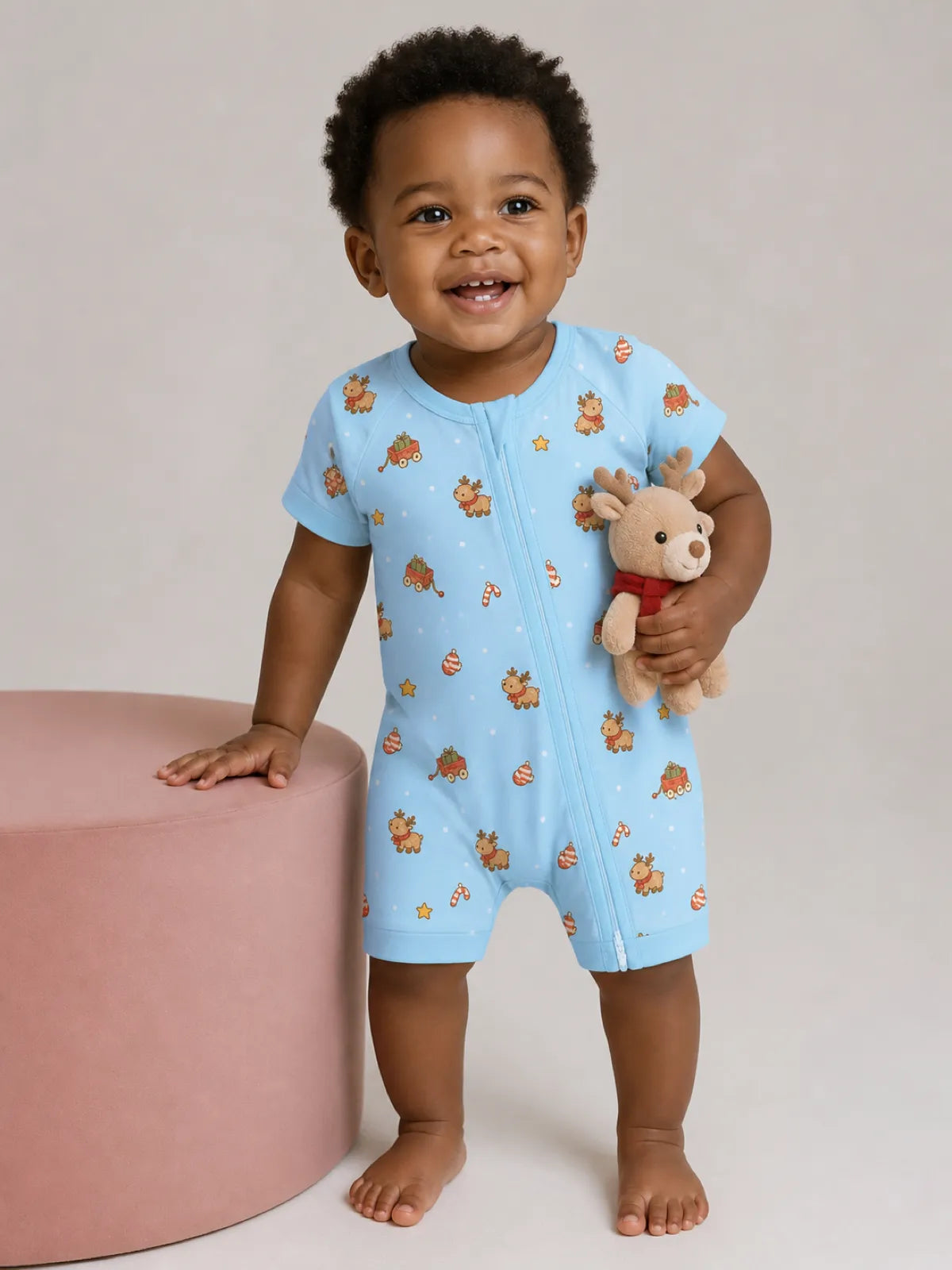 Baby wearing the Reindeer Ride bamboo shorty romper