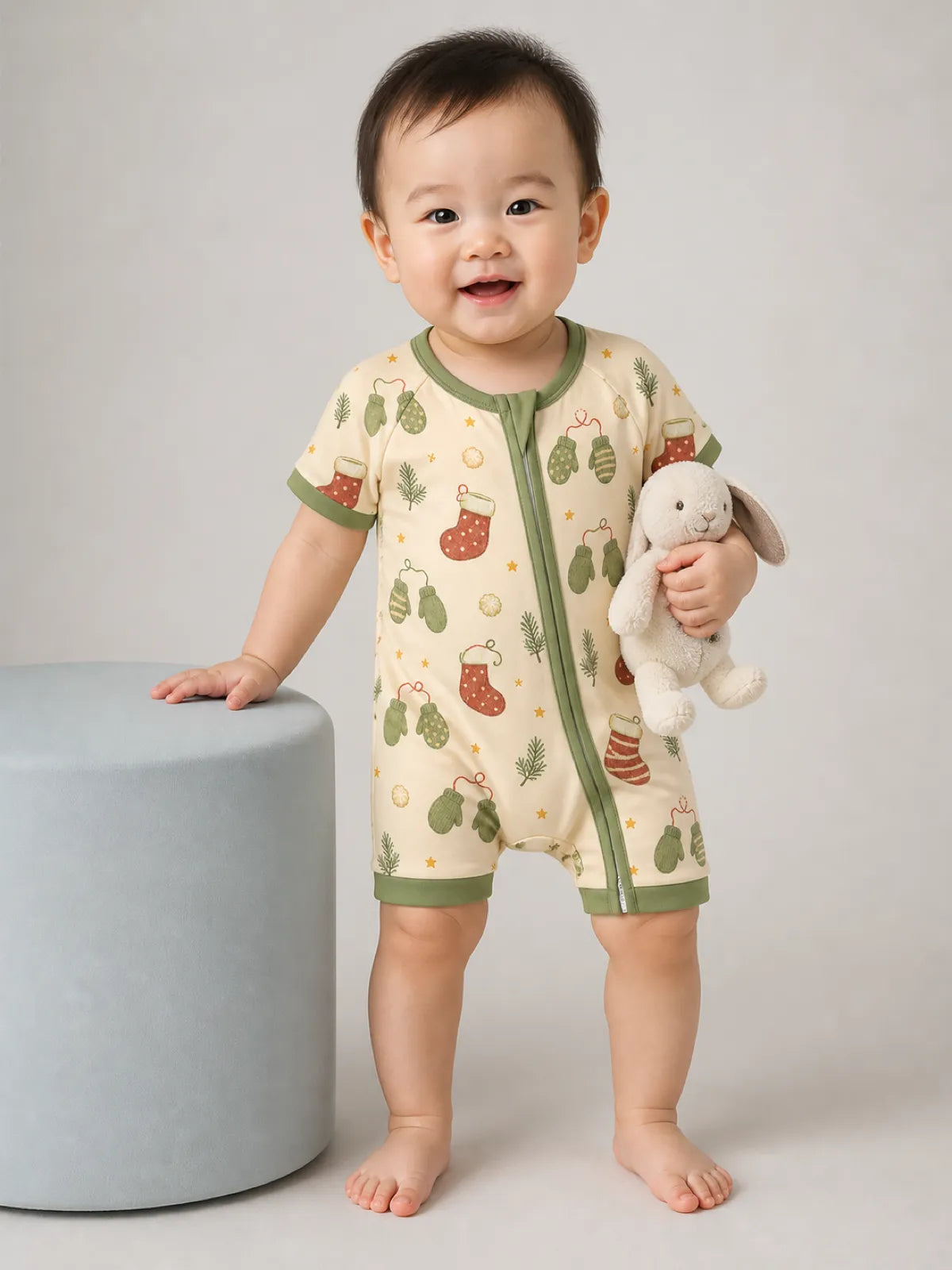 Baby playing at home in the Christmas Stockings shorty romper