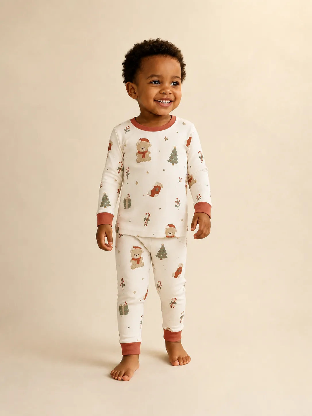 Child wearing the Christmas Teddy long sleeve pajama set