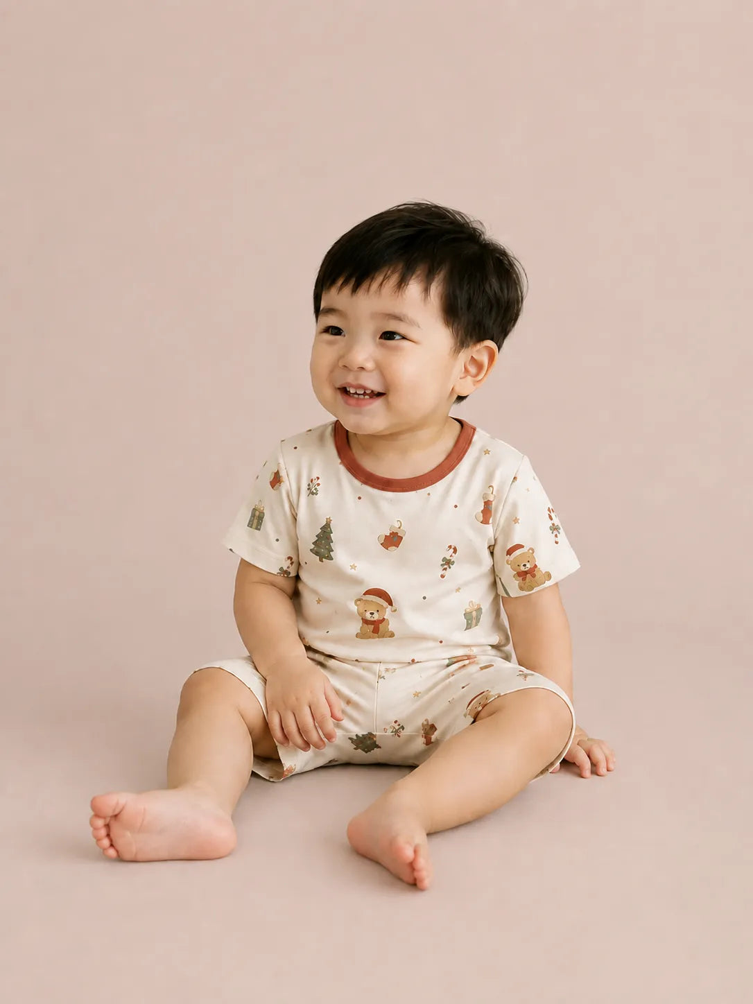 Child wearing the Christmas Teddy short sleeve pajama set
