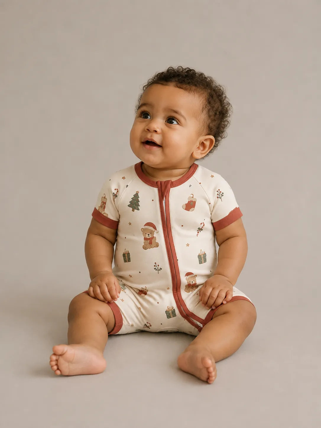 Baby wearing the Christmas Teddy bamboo shorty romper