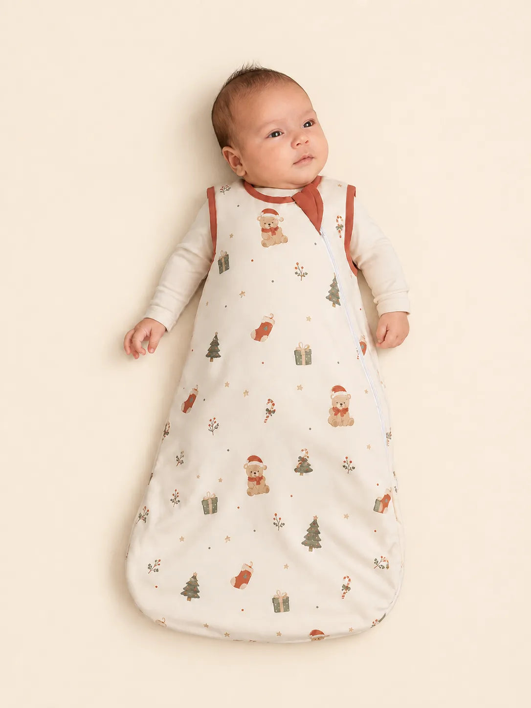 Baby wrapped in the Christmas Teddy bamboo swaddle blanket