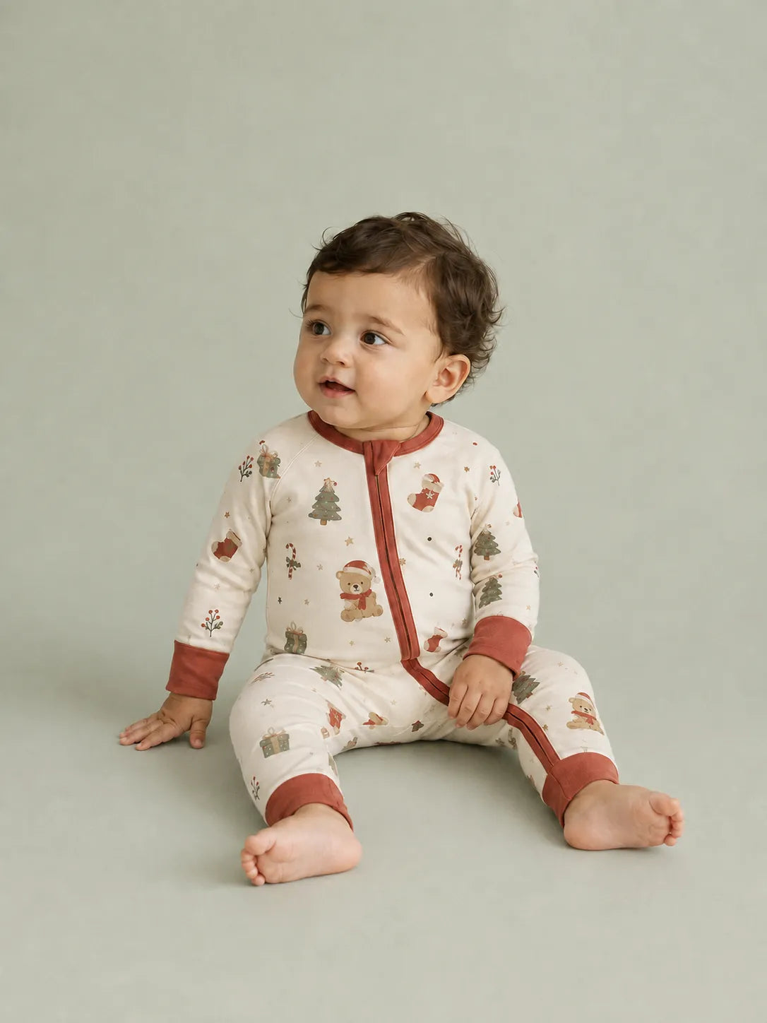 Baby wearing the Christmas Teddy bamboo zipper romper