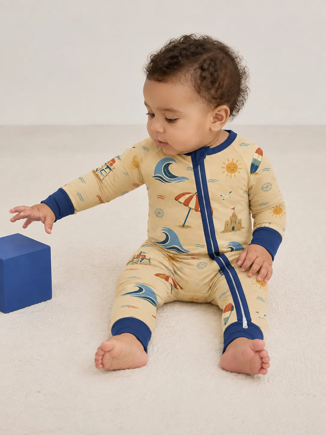 Baby wearing the Beach Day bamboo zipper romper
