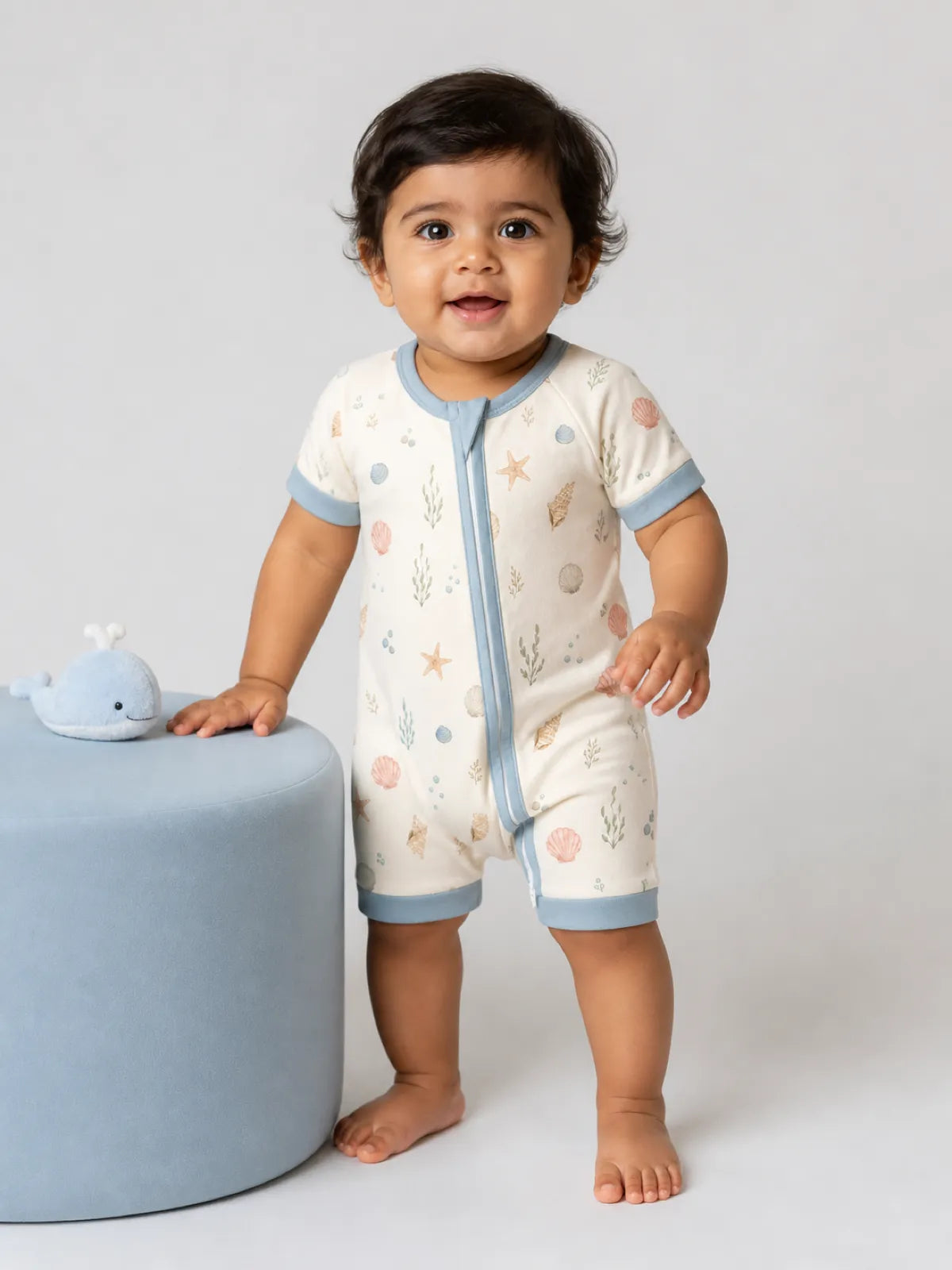Baby wearing the Seaside Treasures bamboo shorty romper
