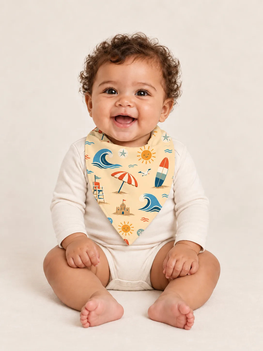 Baby wearing the MossiBaby Beach Day bandana bib with an ivory long-sleeve bodysuit