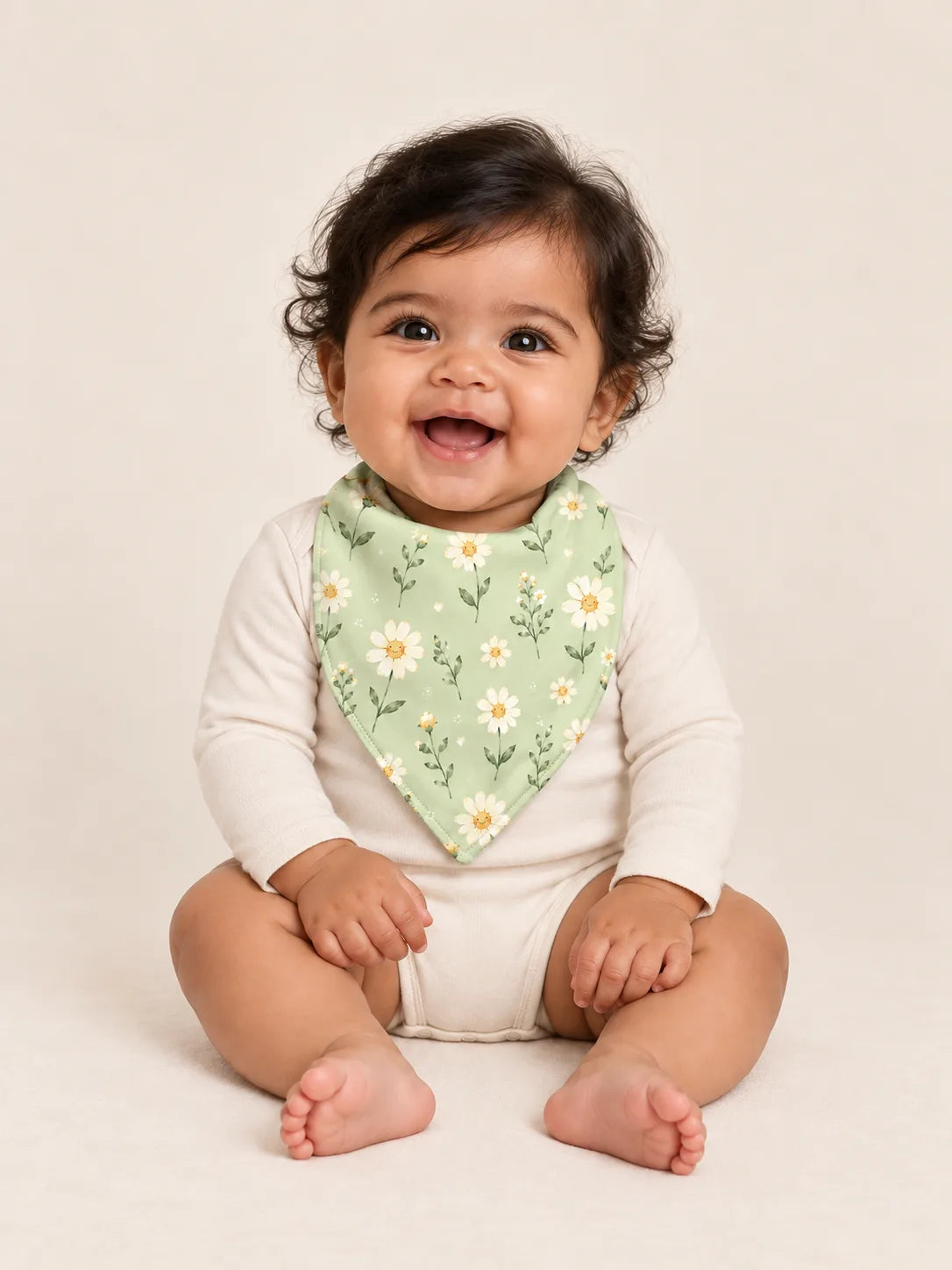 Baby wearing the MossiBaby Daisy Meadow bandana bib with an ivory long-sleeve bodysuit