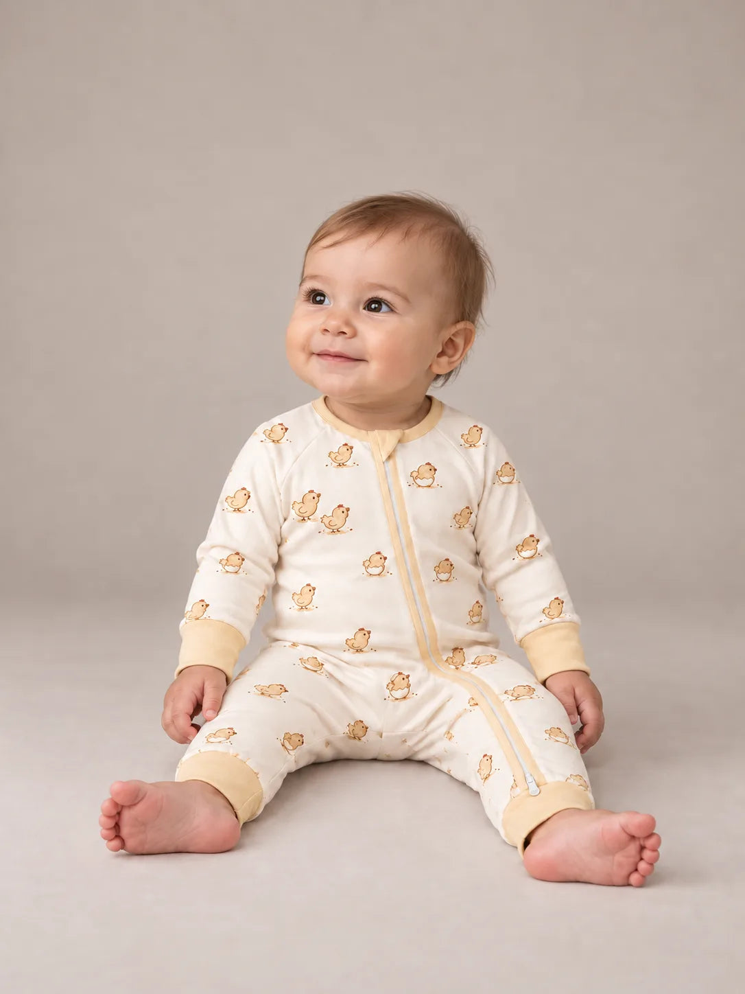 Little Hatchlings Long Zipper Romper studio view on a baby.