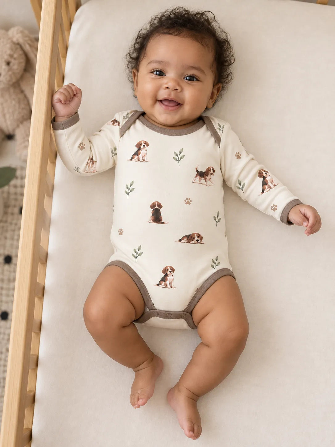 Baby wearing the MossiBaby beagle buddies long sleeve bodysuit in an indoor lifestyle scene