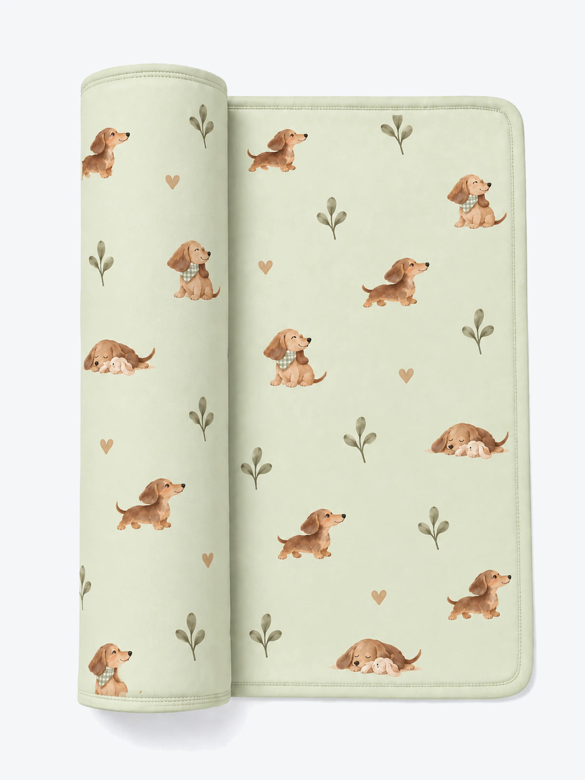 MossiBaby dachshund meadow swaddle blanket featuring dachshunds and leafy sprigs on pale sage