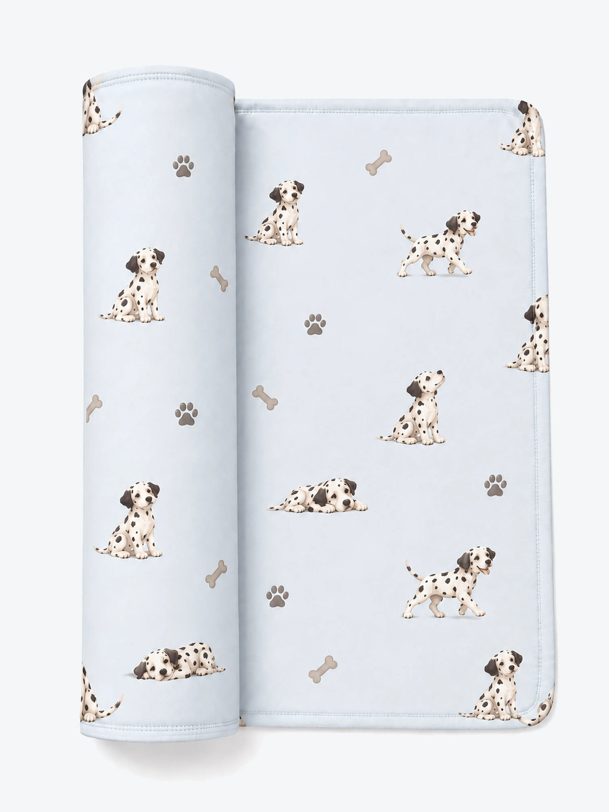 MossiBaby dalmatian days swaddle blanket featuring Dalmatian puppies and paw prints on mist blue