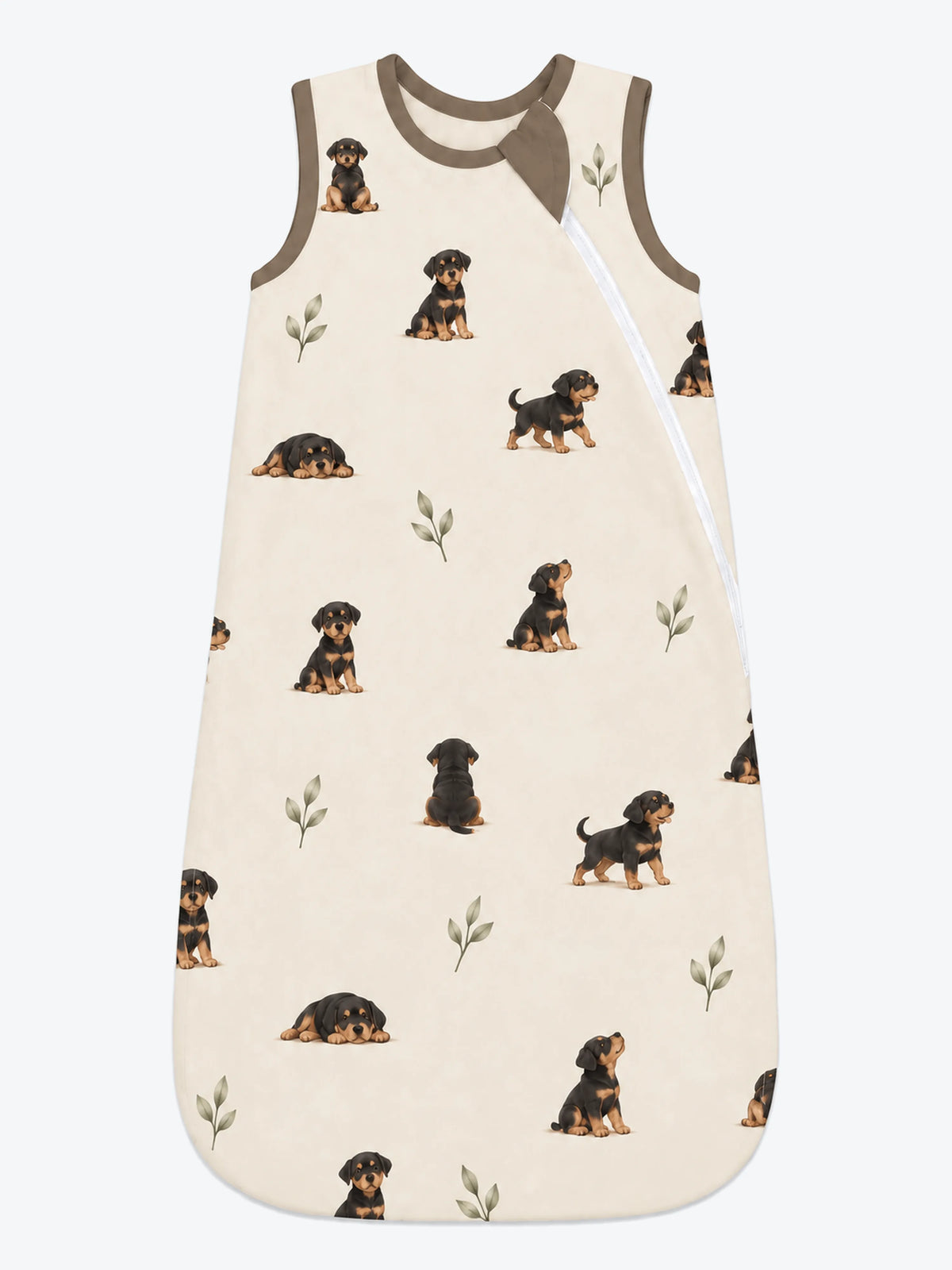 MossiBaby rottie cuddles sleep bag featuring Rottweiler puppies and leafy sprigs on oatmeal
