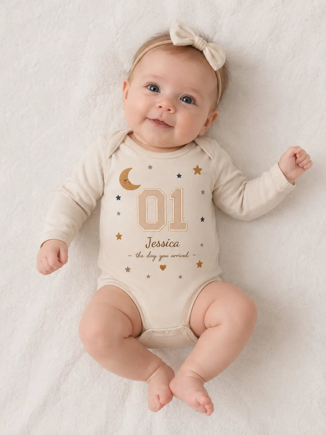 Baby wearing a personalized bodysuit with custom name and number design